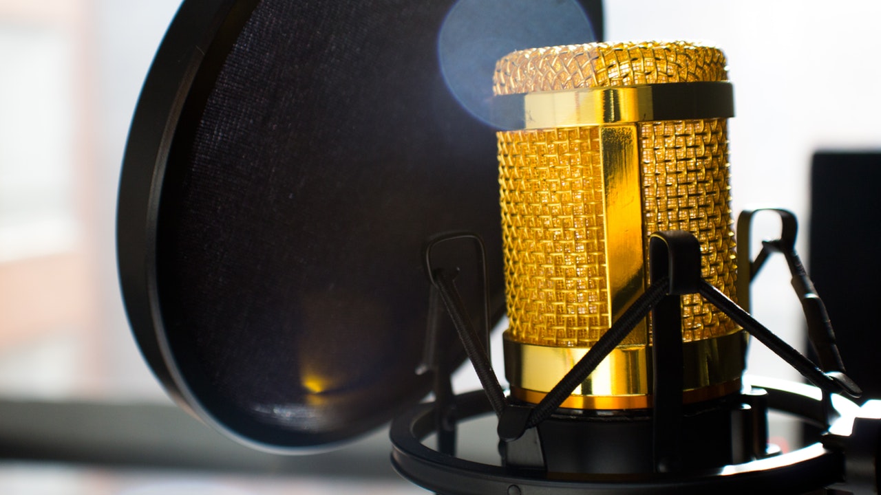 Golden microphone with a pop filter